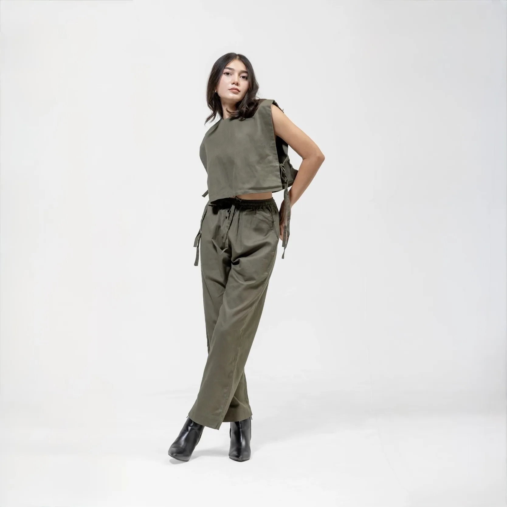 QISSEY OLIVE GREEN CO-ORD SET — view 1 — A STRUCTURAL BOXY CROP TOP WITH SIDE-TIE DETAILING PAIRED WITH MATCHING HIGH-WAISTED RELAXED TROUSER