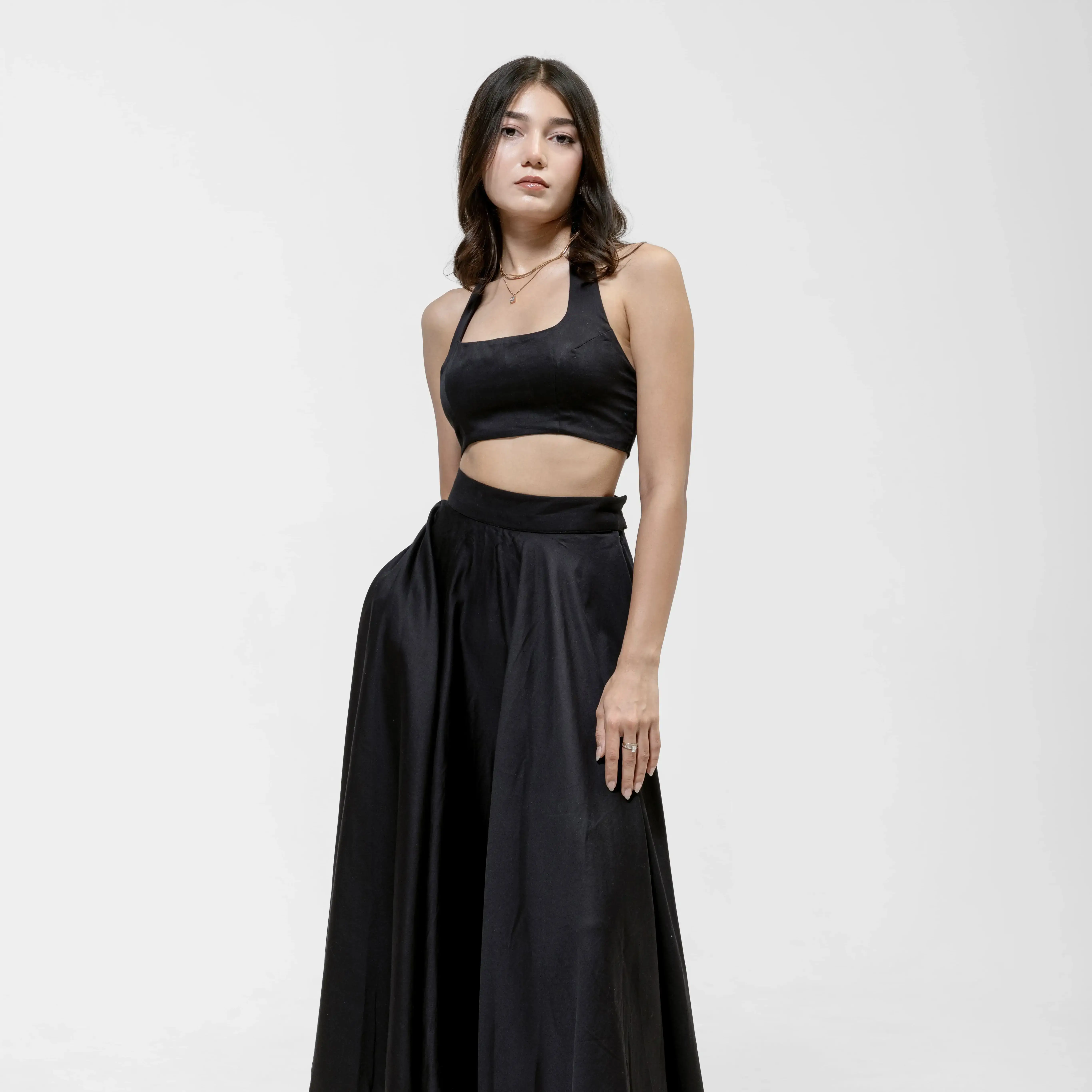 QISSEY BLACK HALTER CROP TOP — view 1 — FITTED HALTER-NECK CROP TOP DESIGNED WITH A CLEAN SQUARE NECKLINE AND WIDE SUPPORTIVE STRAPS. CREATE