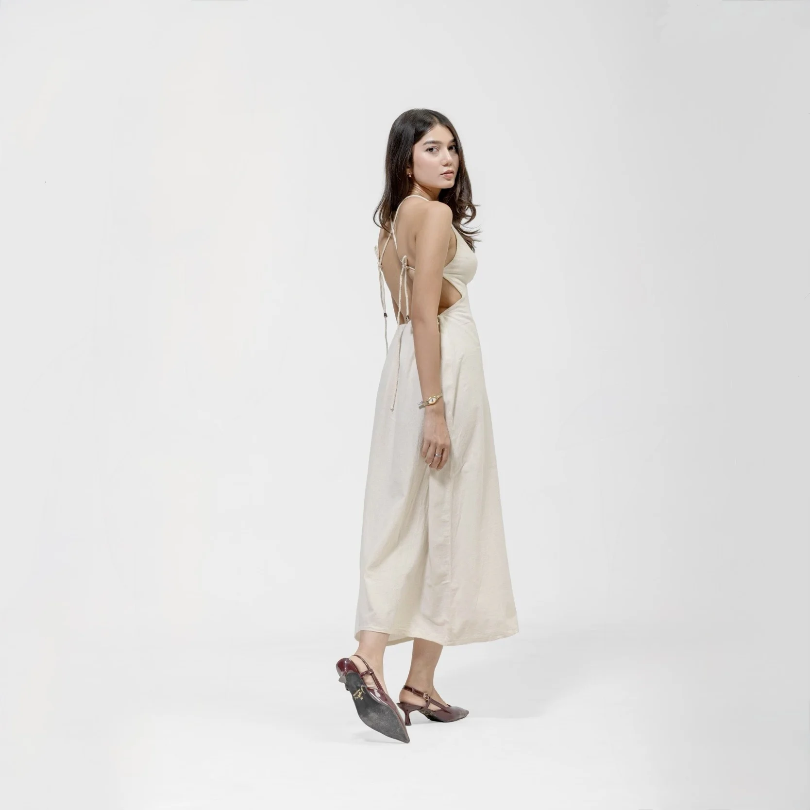 QISSEY BEIGE OPEN-BACK MIDI DRESS — view 1 — MINIMALIST MIDI DRESS DESIGNED WITH A DELICATE, STRAPPY HALTER BODICE THAT FLOWS INTO A FULL SKIRT. 